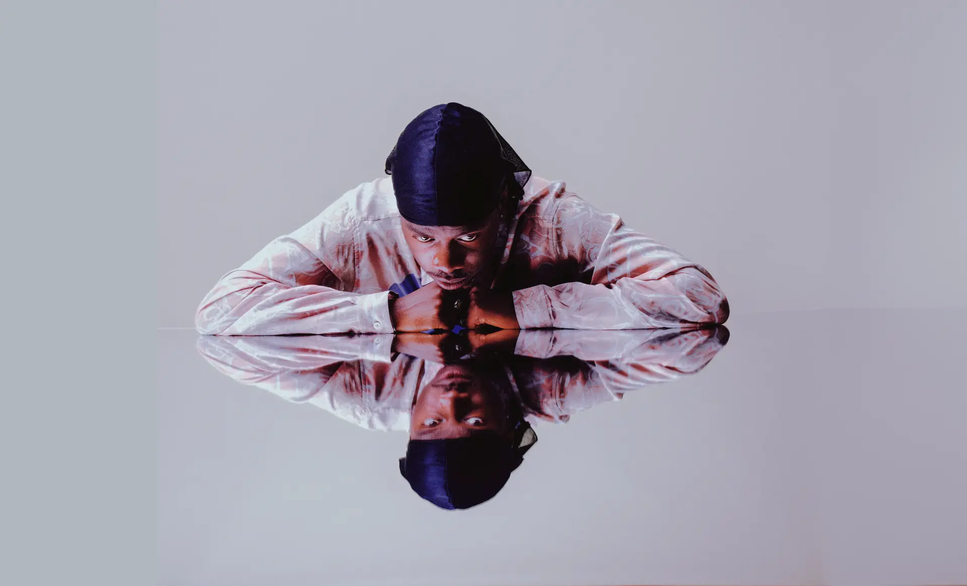MasterPeace reflected across a mirrored surface