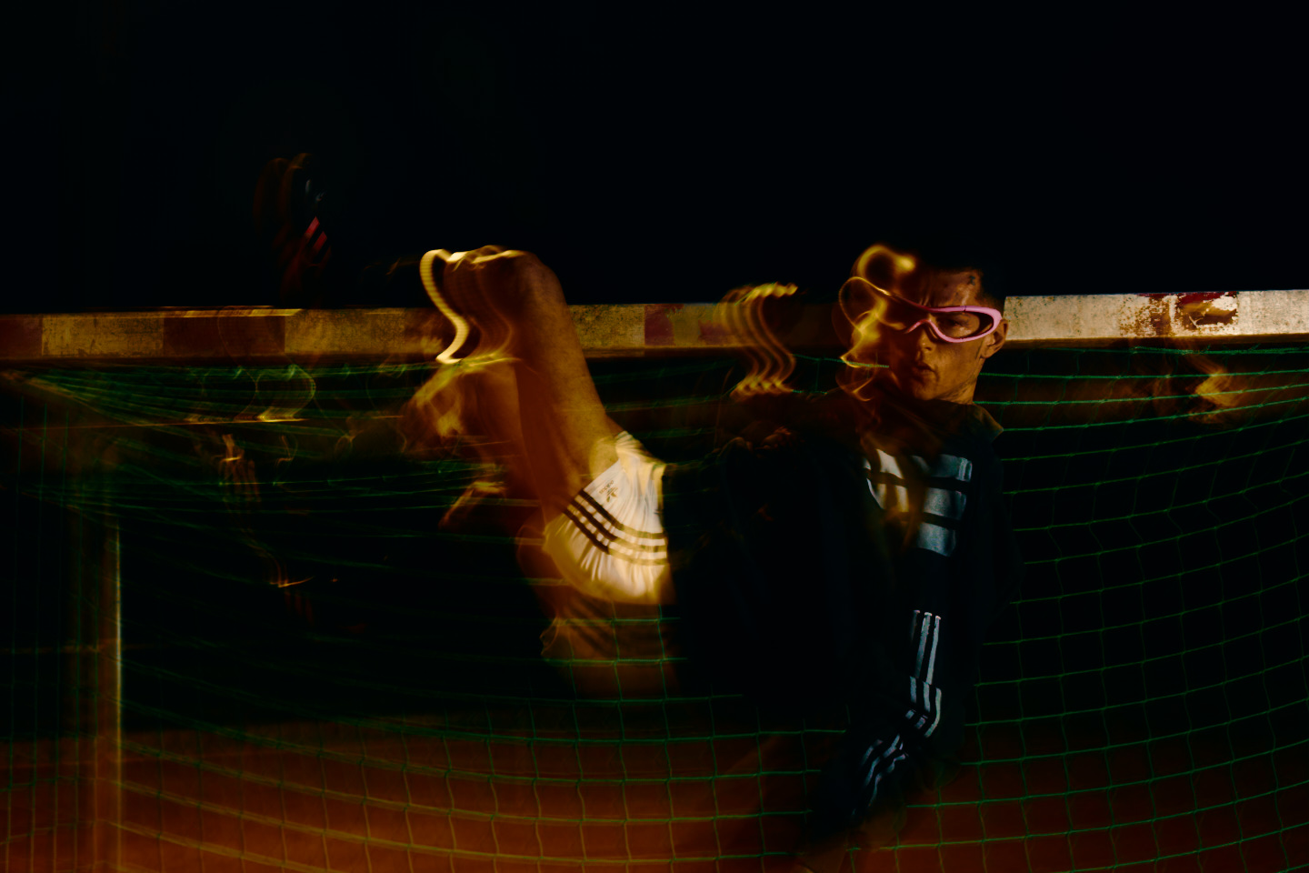 Adidas X Huni — footballer in pink glasses at the goal