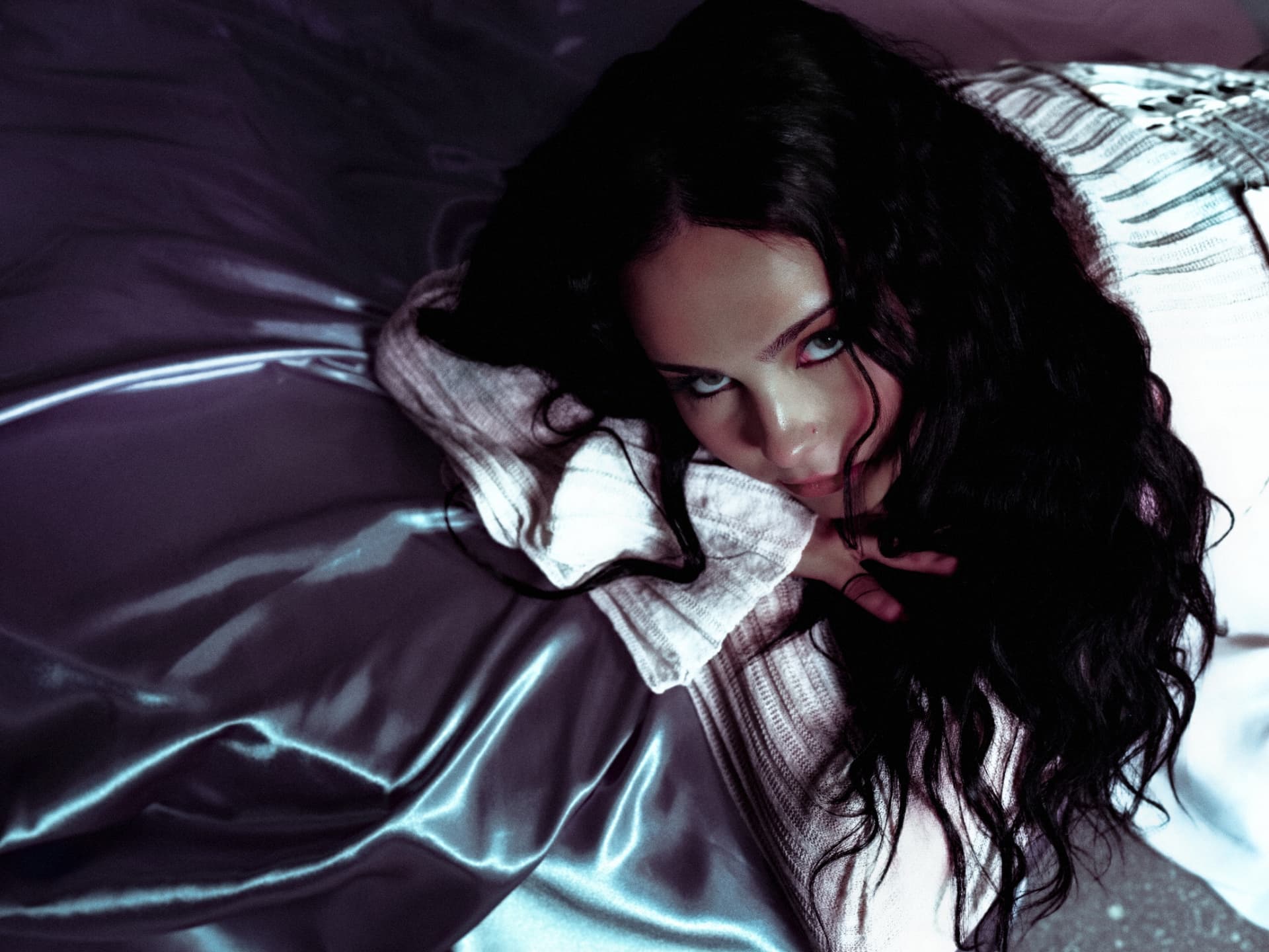 Close portrait of Sabyna against silver fabric