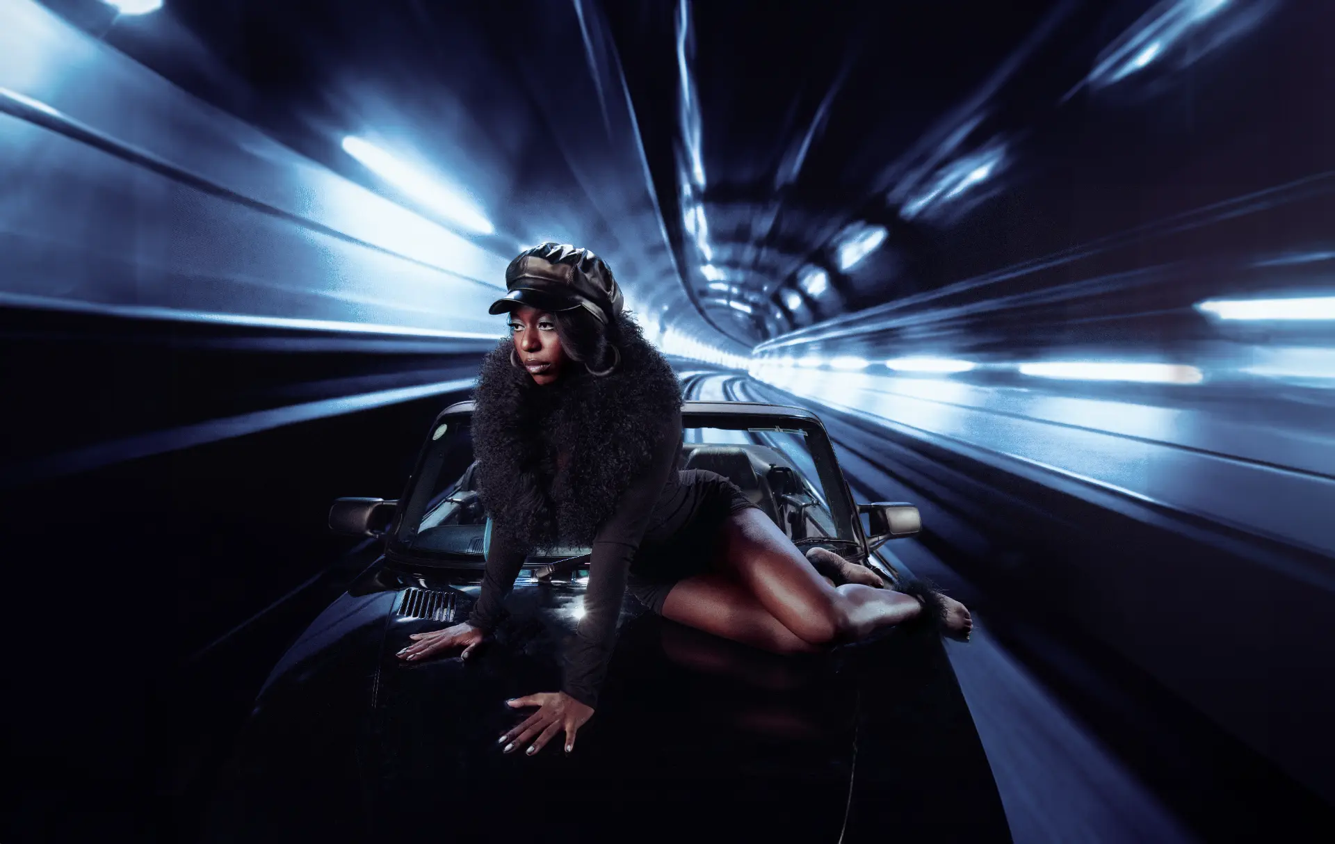 Catching Cairo — performer on a car bonnet speeding through a lit tunnel