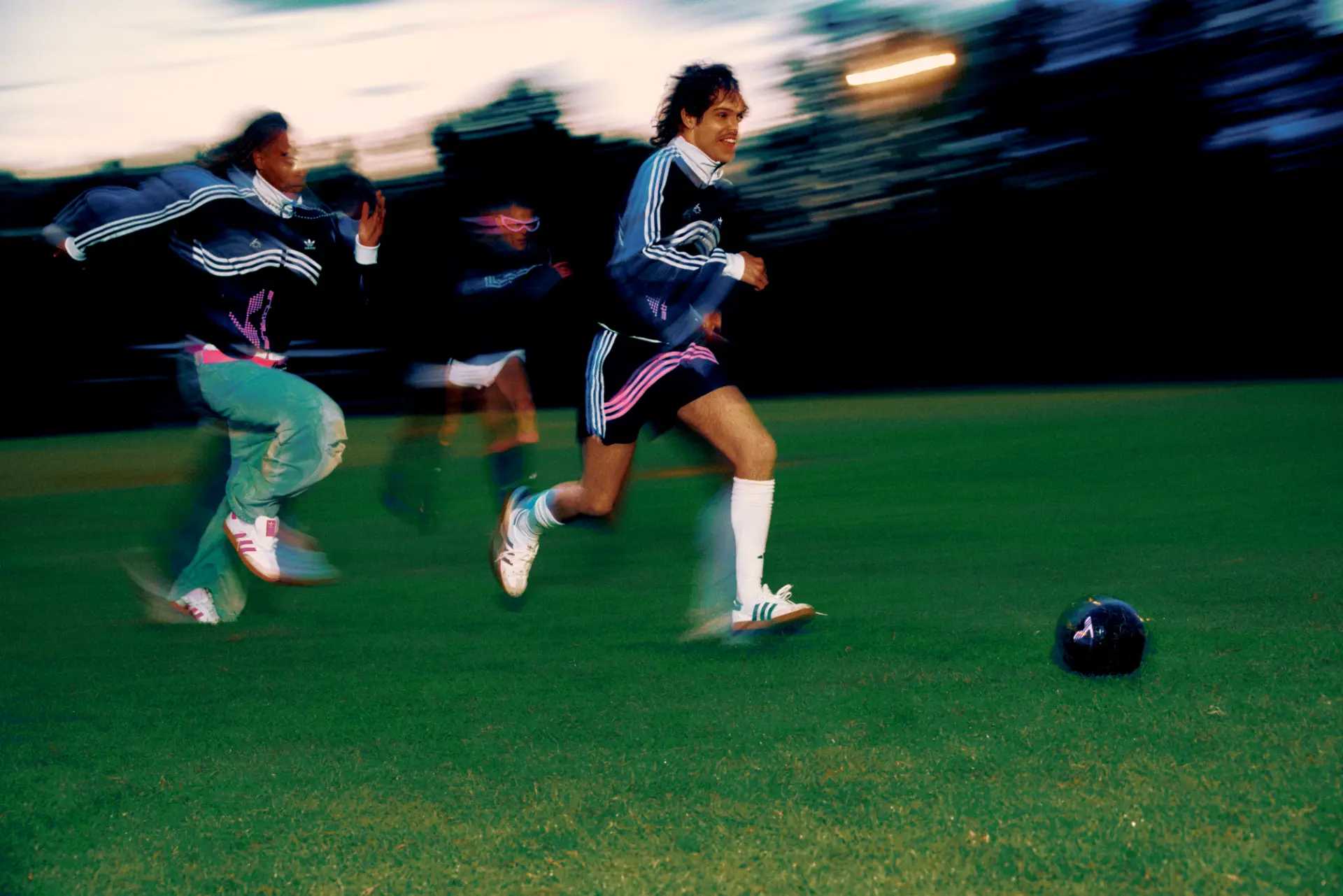 Adidas X Huni — players running across the pitch