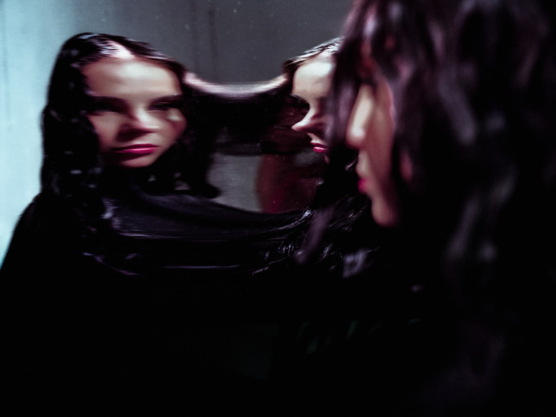 Sabyna reflected across multiple mirrors