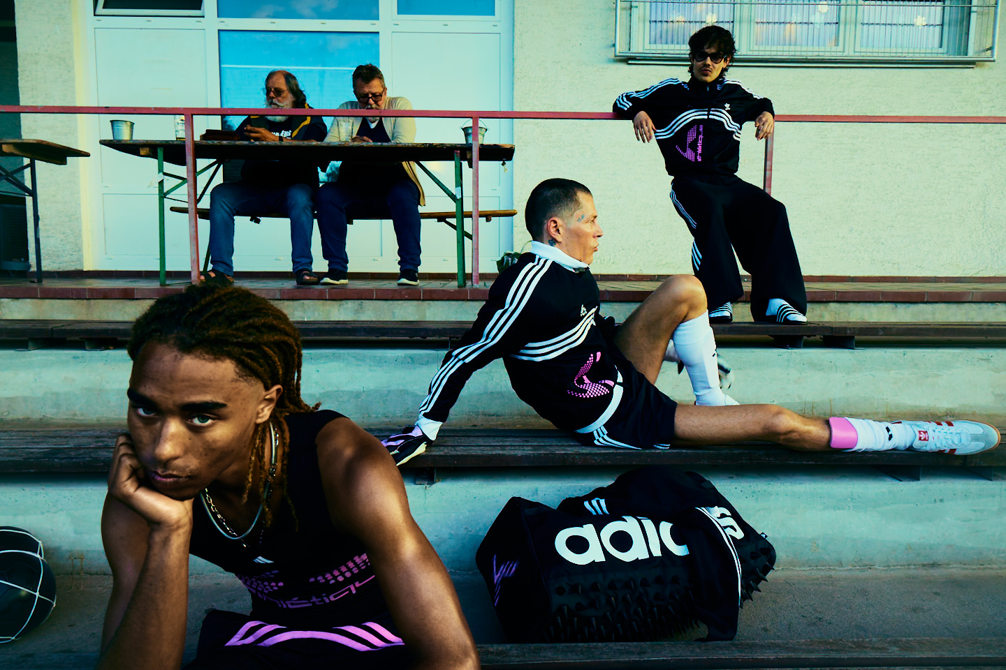 Adidas X Huni — players beside the pitch