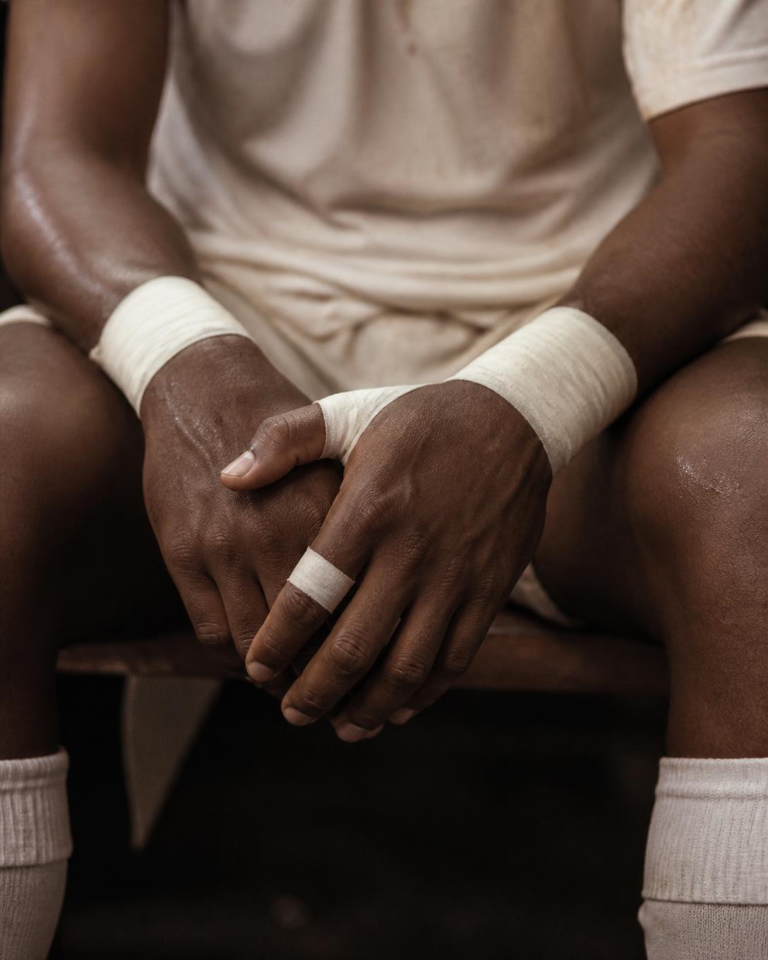Athlete's taped hands at rest